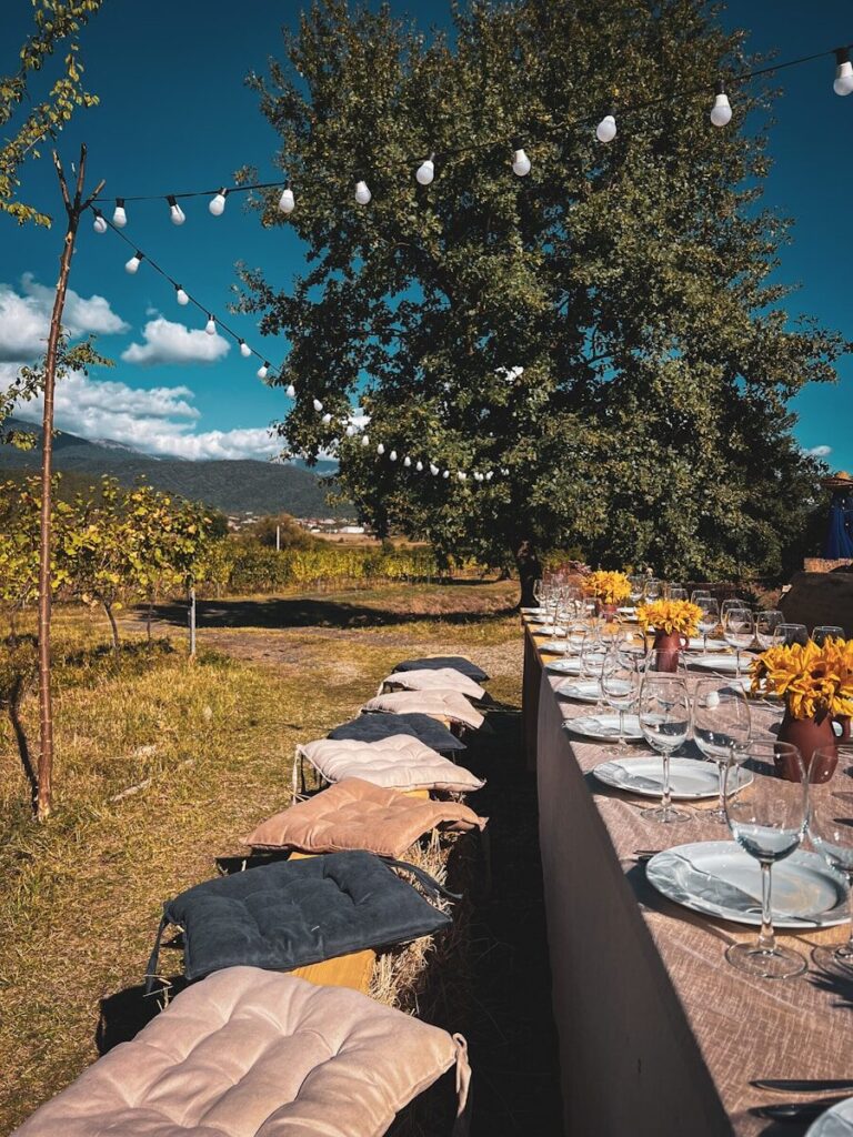 a long table with plates and glasses on it